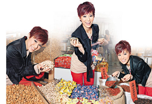 胡杏儿办年货扫千元零食望事业全面开花(图)