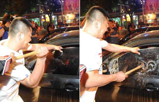 北京“黑车”司机拒检查 执法人员锤子破窗